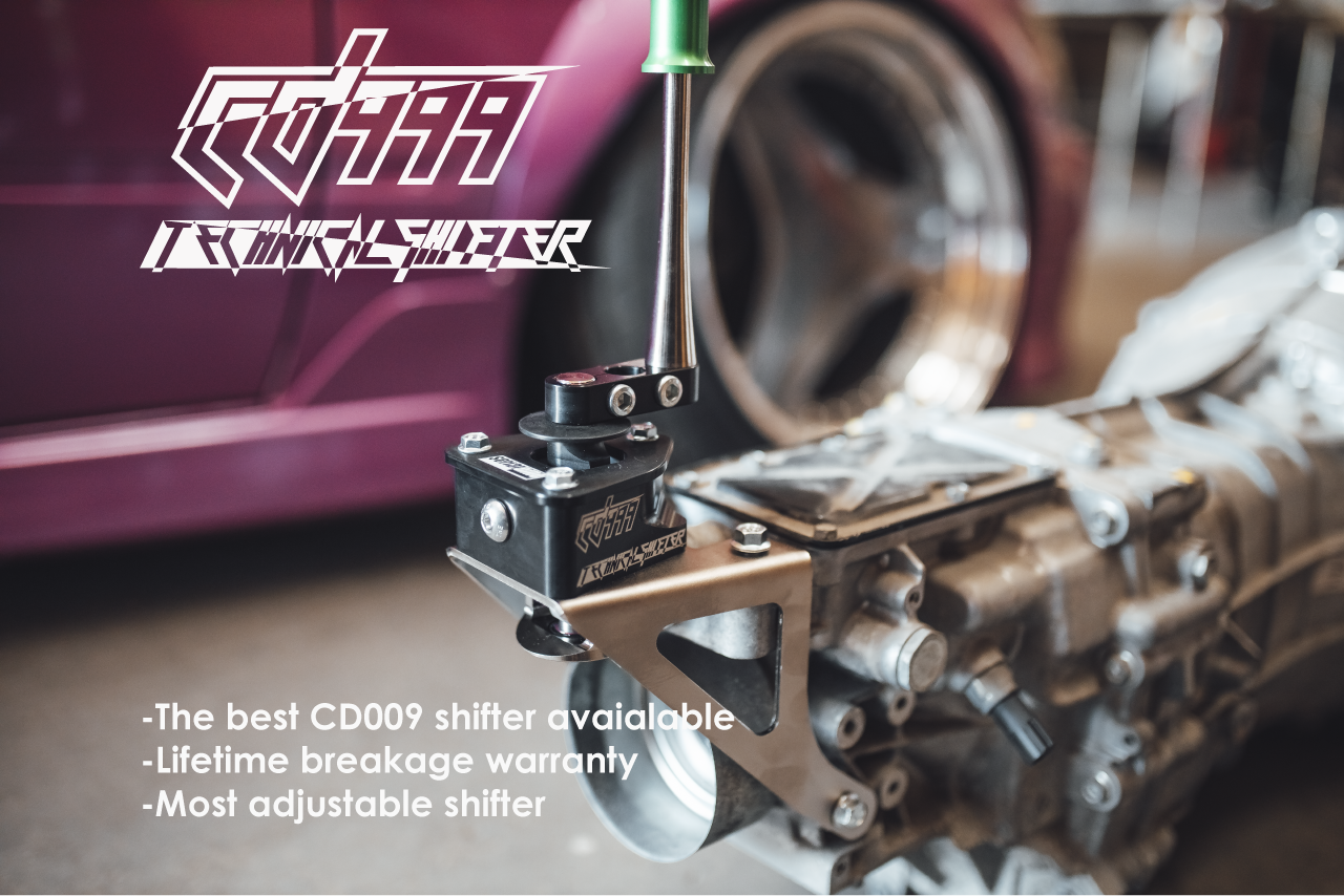 Close-up of a CD999 shifter on a transmission. Features lifetime breakage warranty and high adjustability.