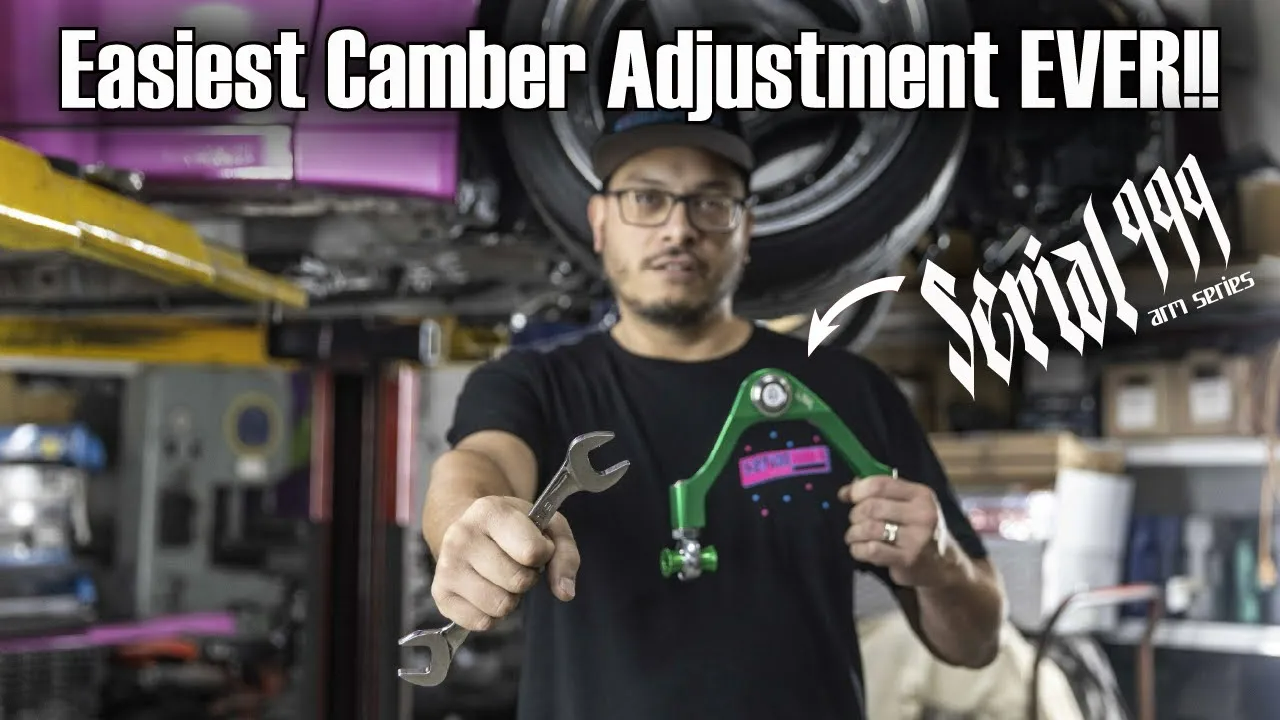 Mechanic holding a wrench and SERIAL999 camber arm with "Easiest Camber Adjustment EVER!!" and "Serial999 arm series"